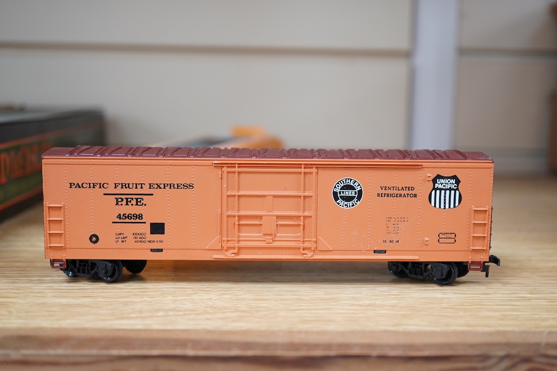 A quantity of US outline HO railway by Athearn, Bachmann, etc. including three locomotives; a Union Pacific Bo-Bo diesel, 1468, a Santa Fe Bo-Bo diesel, 5707, and a Santa Fe 0-4-0 tender engine, together with a 12-wheel